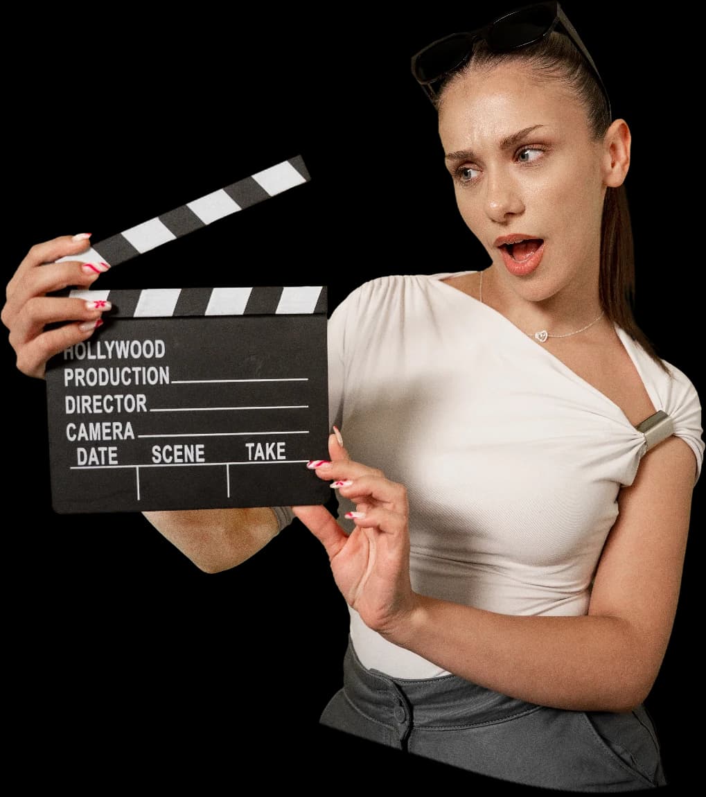 Ina Ilieva, content producer, holding a film clapperboard